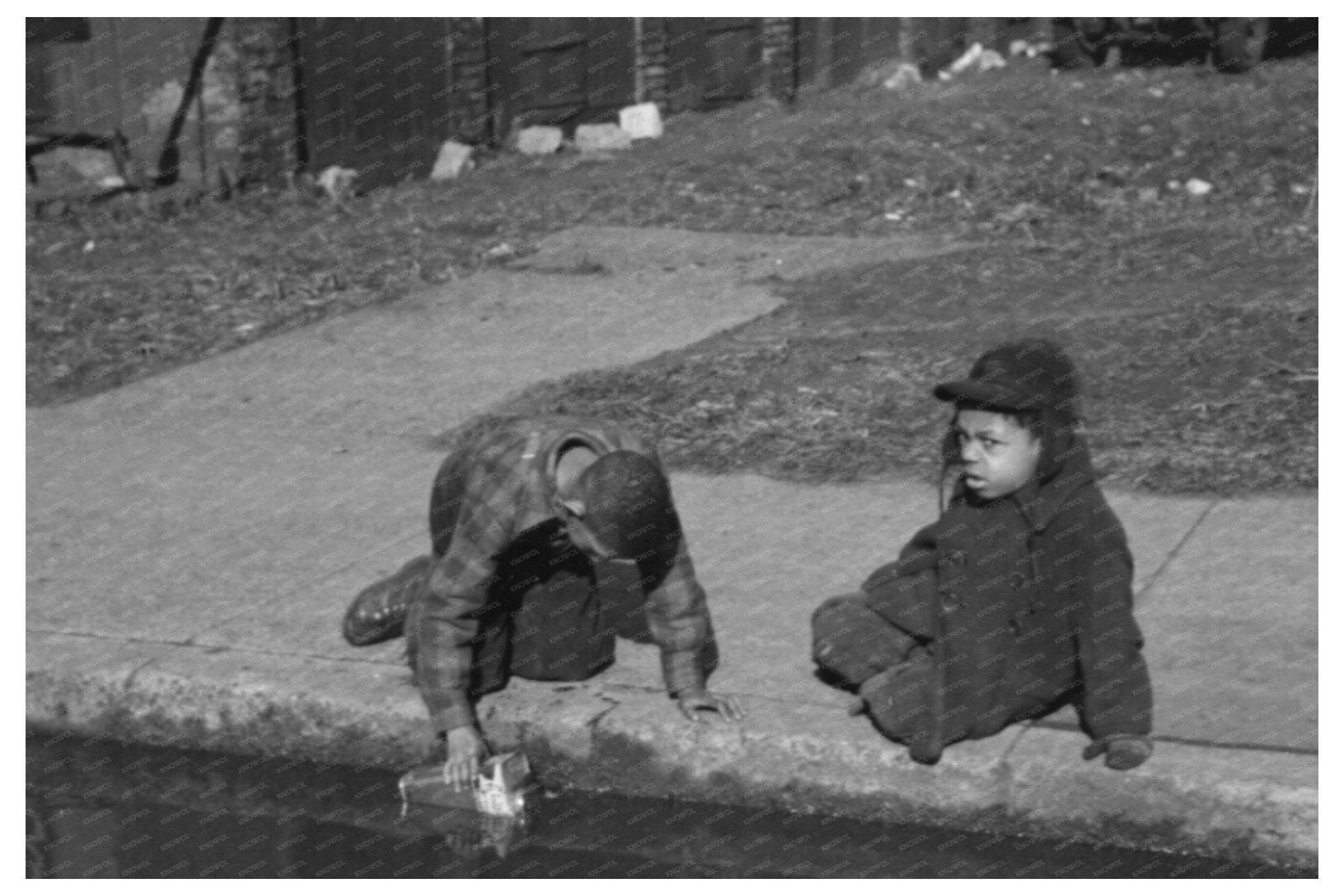 Children Playing in Water Gutter Chicago April 1941 - Available at KNOWOL