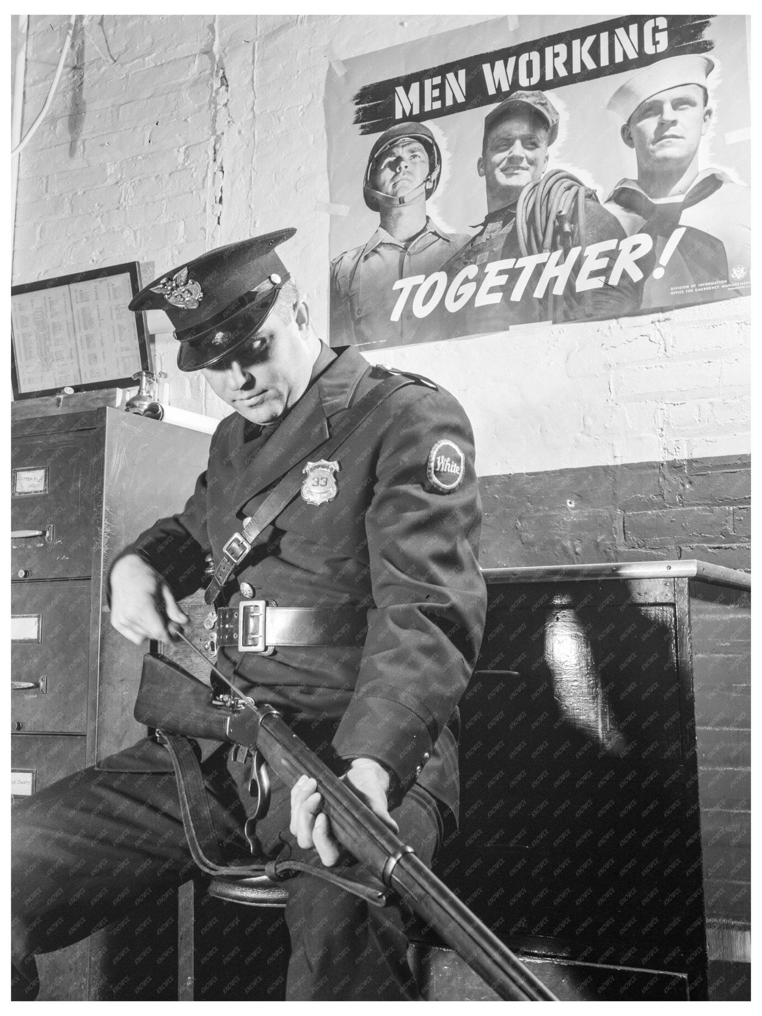 Cleveland Patrolman with Rifle at Defense Plant 1941 - Available at KNOWOL