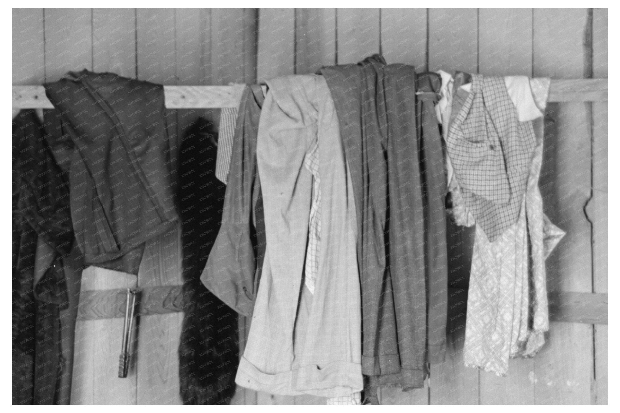 Clothes on Hangers in Sharecropper Cabin May 1938 - Available at KNOWOL