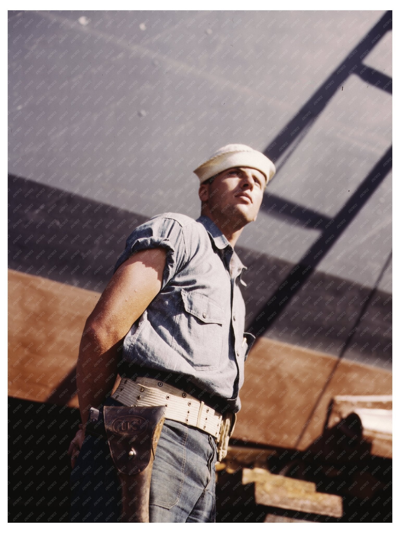 Coast Guardsman with 78 - Foot Torpedo Boat July 1942 - Available at KNOWOL