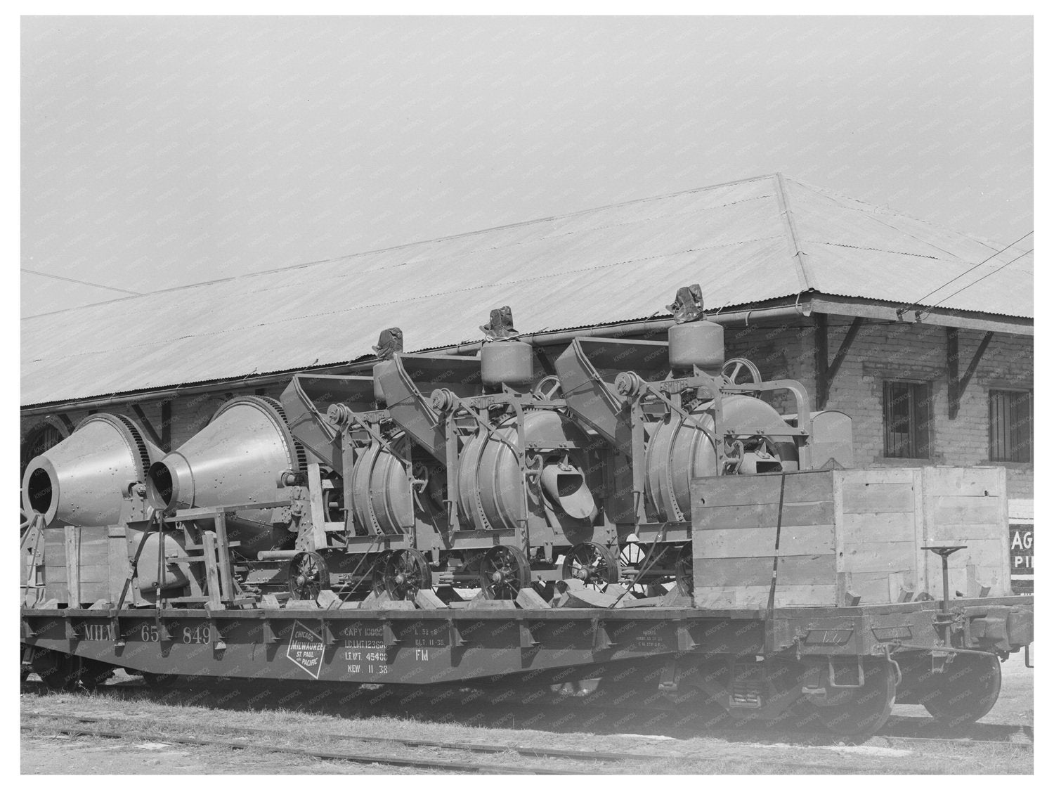Concrete Mixers on Flatcar Eagle Pass Texas March 1939 - Available at KNOWOL