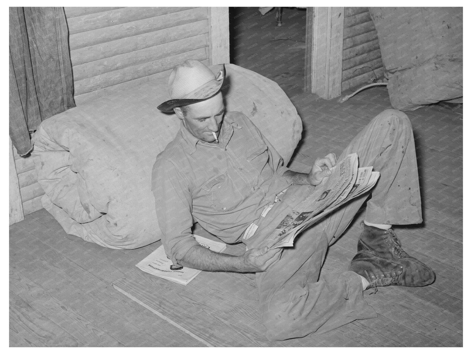 Cook Reading Newspaper at SMS Ranch Spur Texas May 1939 - Available at KNOWOL
