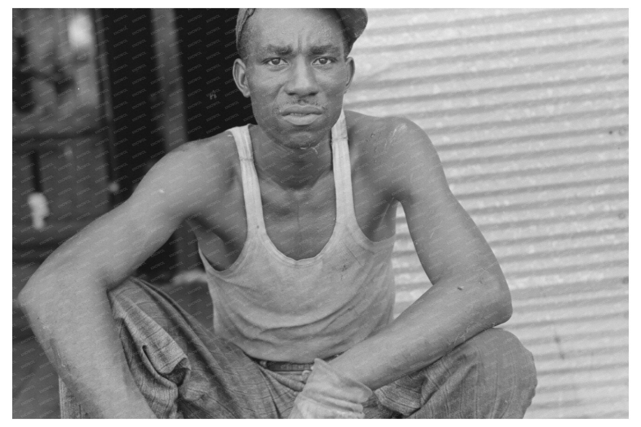 Cotton Gin Worker in Lehi Arkansas September 1938 - Available at KNOWOL