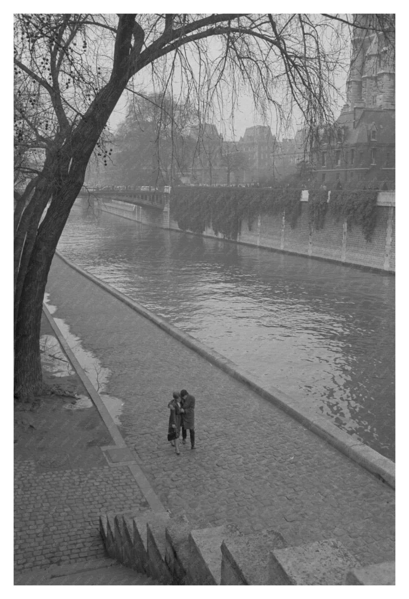 Couple Strolling by Seine River Paris March 1964 Vintage Photo - Available at KNOWOL