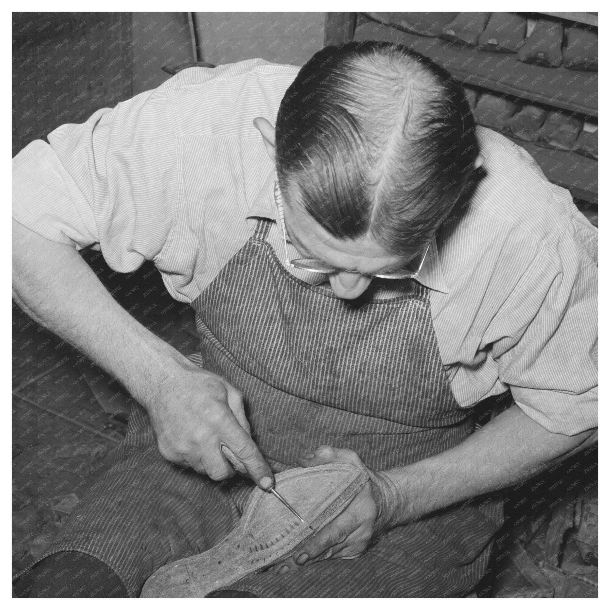 Cowboy Bootmaker Punching Holes May 1939 Alpine Texas - Available at KNOWOL