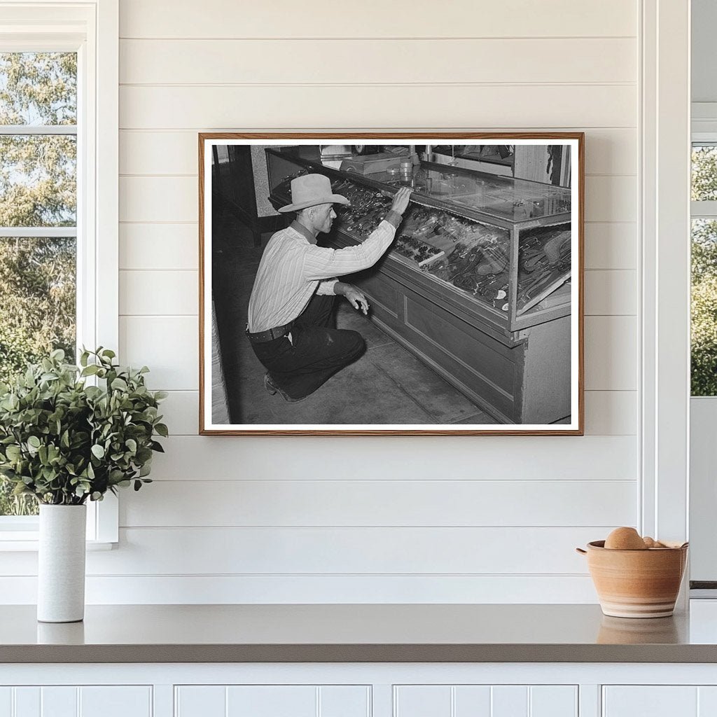 Cowboy Examining Spurs in Alpine Texas 1939 - Available at KNOWOL