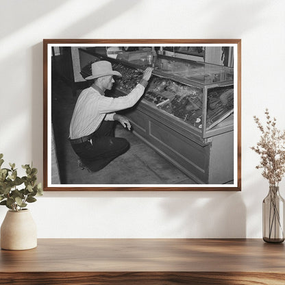 Cowboy Examining Spurs in Alpine Texas 1939 - Available at KNOWOL
