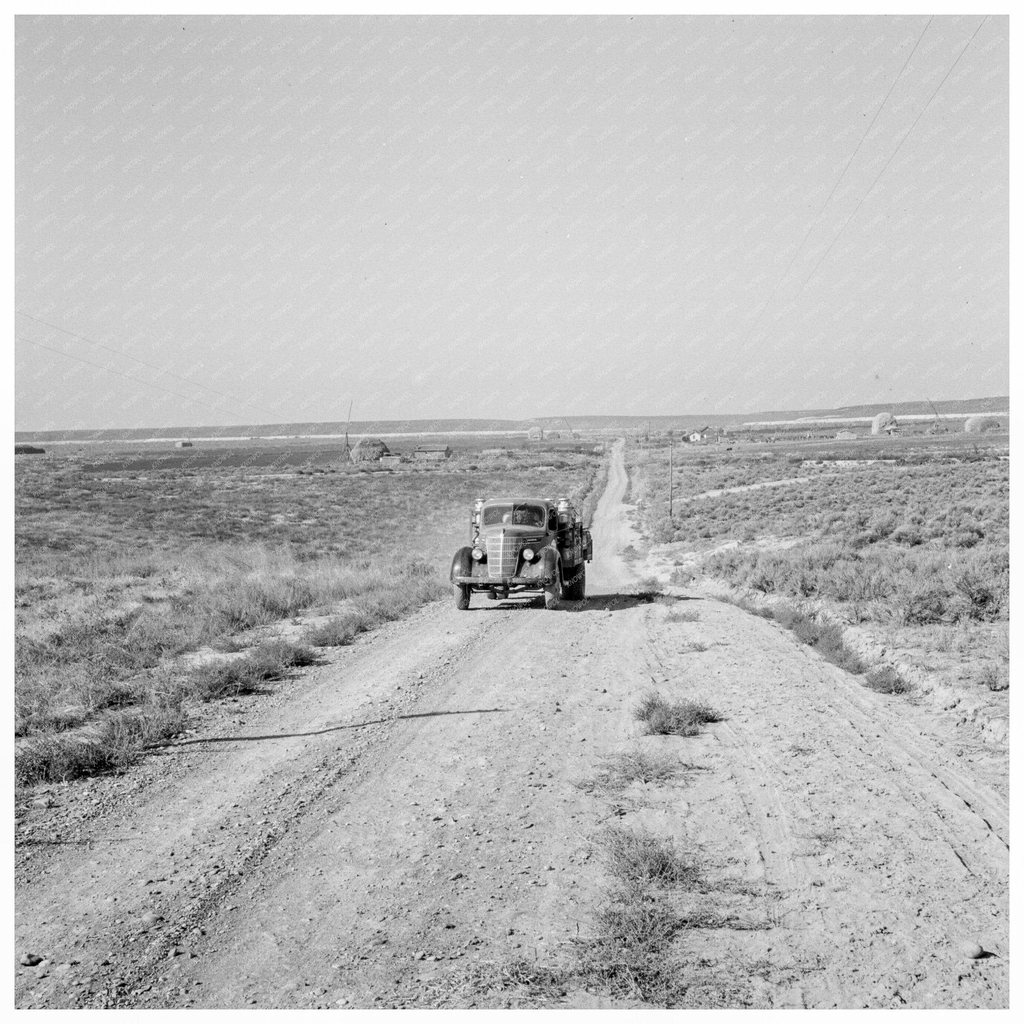 Cream Truck on Road in Nyssa Heights Oregon 1939 - Available at KNOWOL