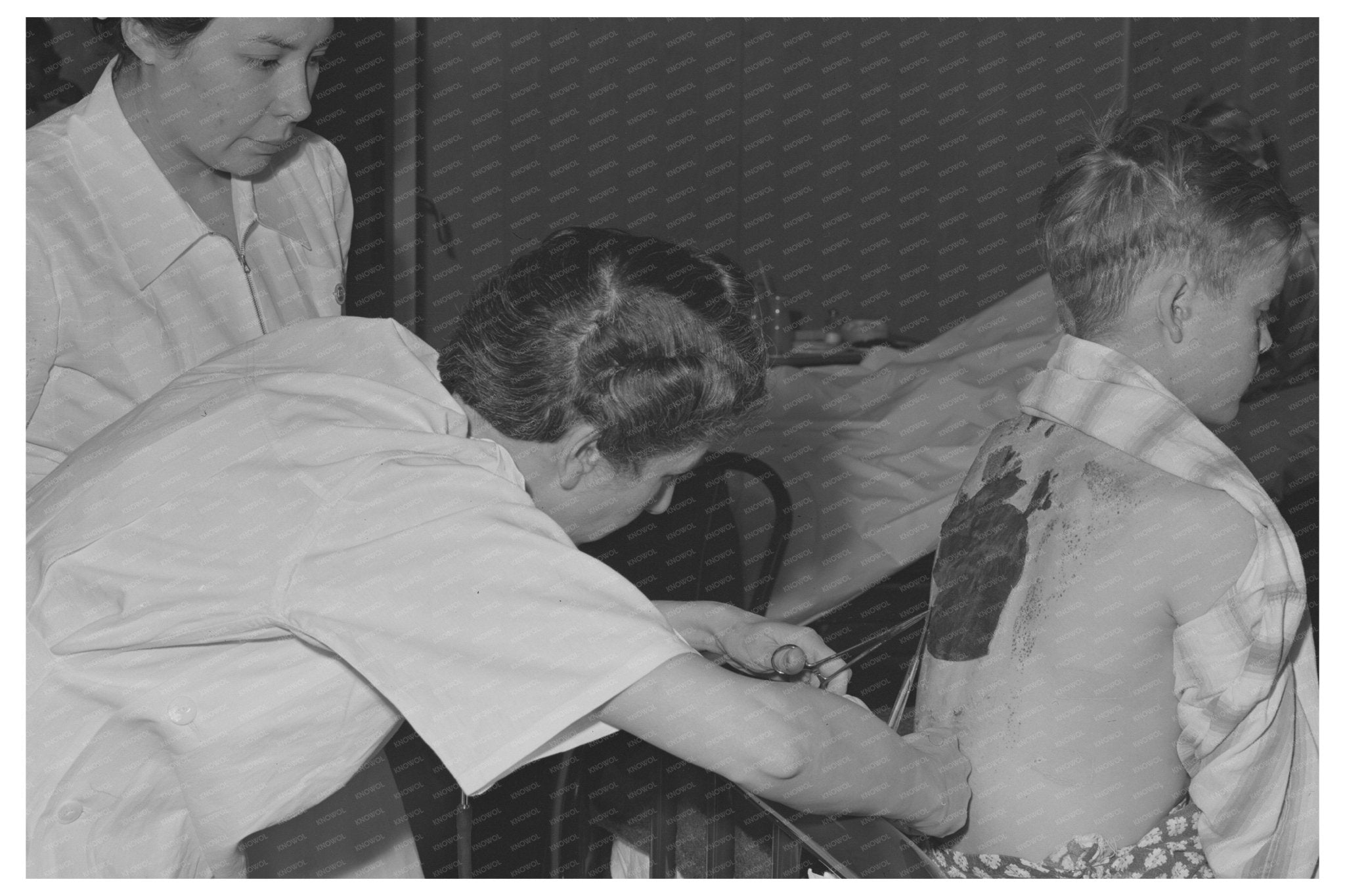 Doctor Treating Burn Injury in Eleven Mile Corner Arizona 1942 - Available at KNOWOL