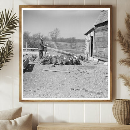 Erasty Emrich Feeding Chickens on Farm Indiana March 1937 - Available at KNOWOL