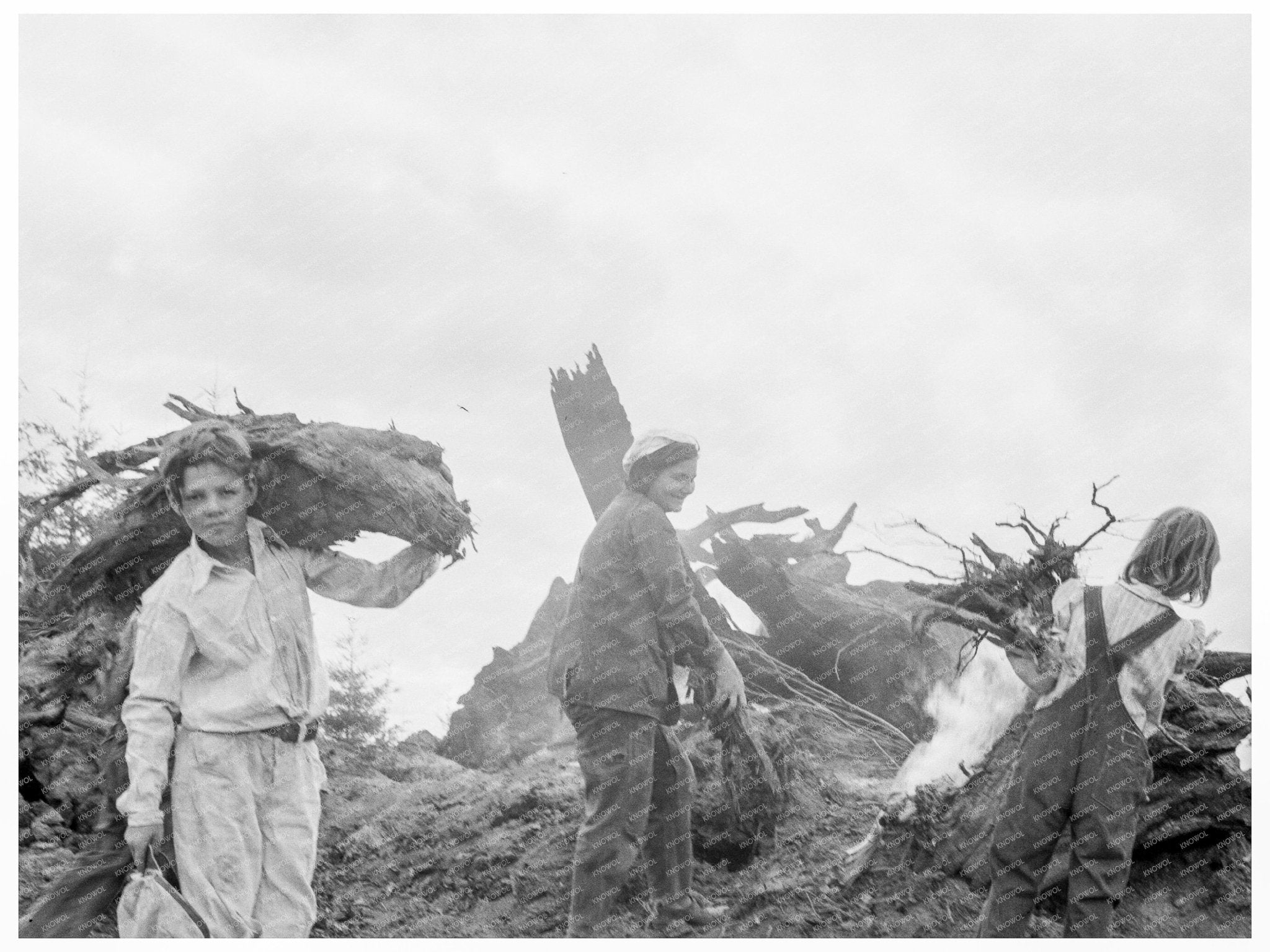 Family Collects Debris After Bulldozer Work in 1939 - Available at KNOWOL