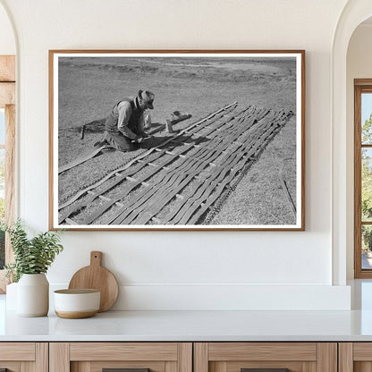 Farmer Repairing Conveyor Belt in Imperial County 1942 - Available at KNOWOL