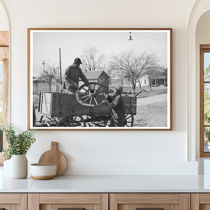 Farmer Repairs Wagon Wheel in Depew Oklahoma 1940 - Available at KNOWOL