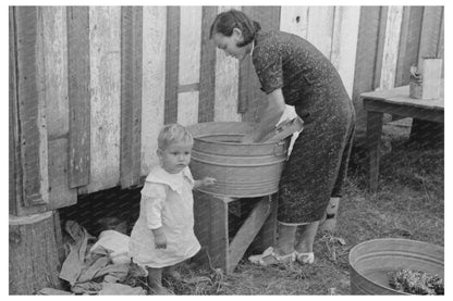 Farmers Wife Doing Laundry with Son November 1938 - Available at KNOWOL