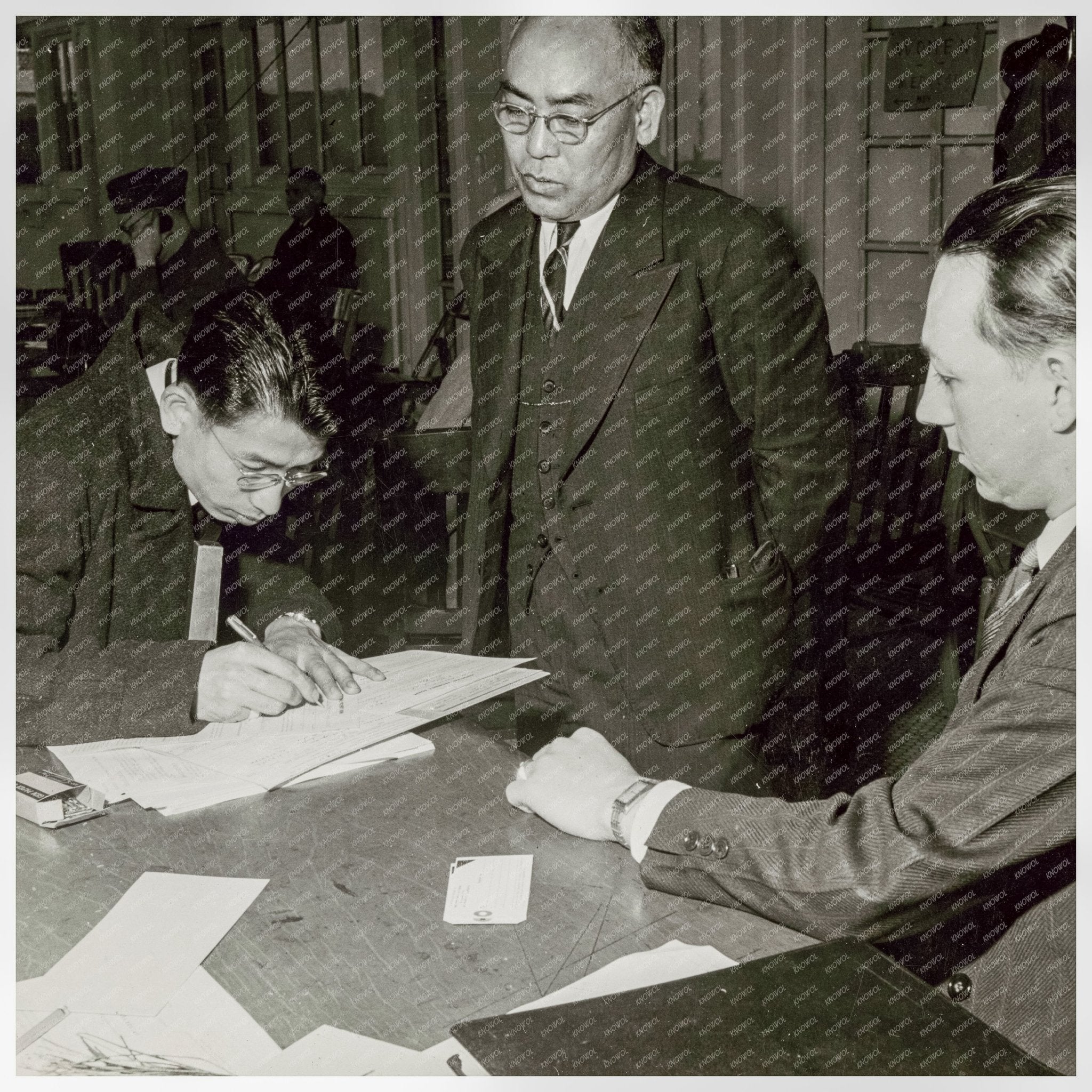 Father and Son Registering for Japanese American Evacuation 1942 - Available at KNOWOL