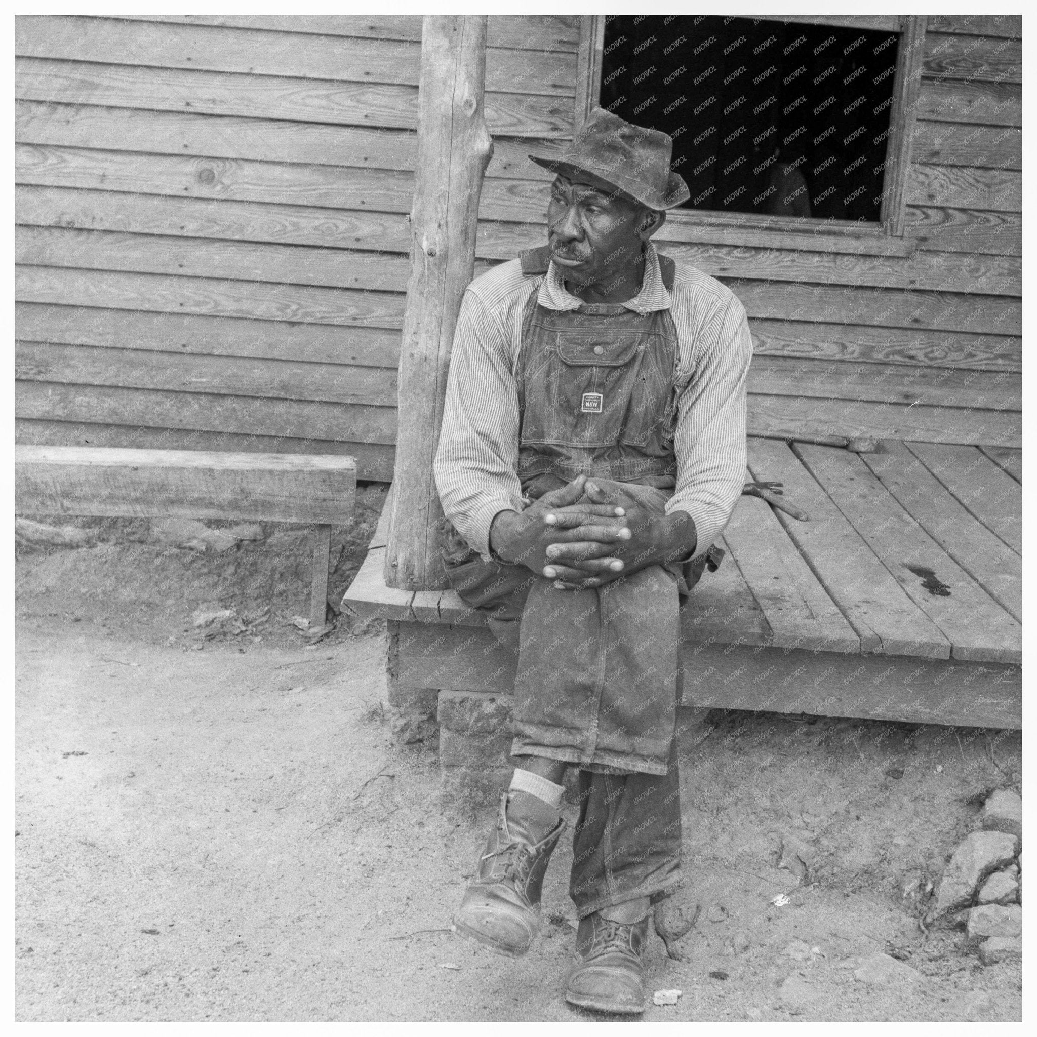 Father of Sharecropper Family on Porch North Carolina 1939 - Available at KNOWOL