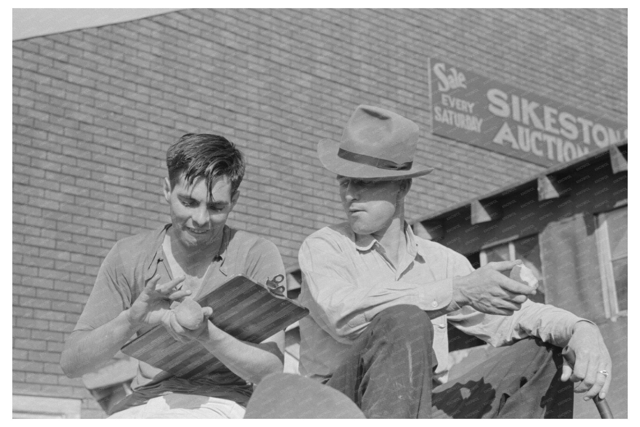 Fruit Auctioneer Enjoys Peaches Sikeston Missouri 1938 - Available at KNOWOL