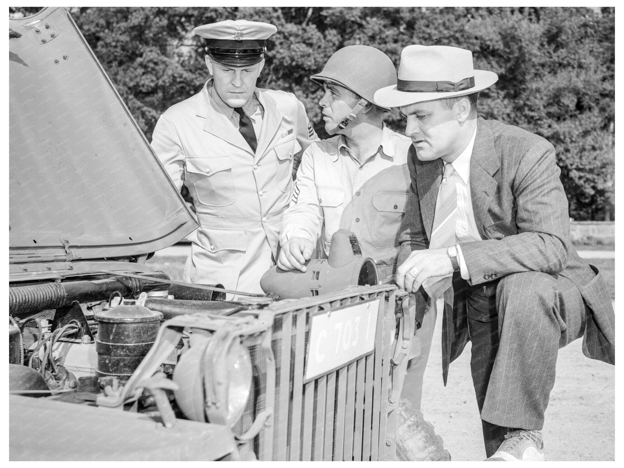 George Woolslayer Inspects Army Jeep August 1942 - Available at KNOWOL