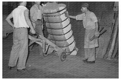 Guiding Cotton Bale onto Hand Truck Houston 1939 - Available at KNOWOL