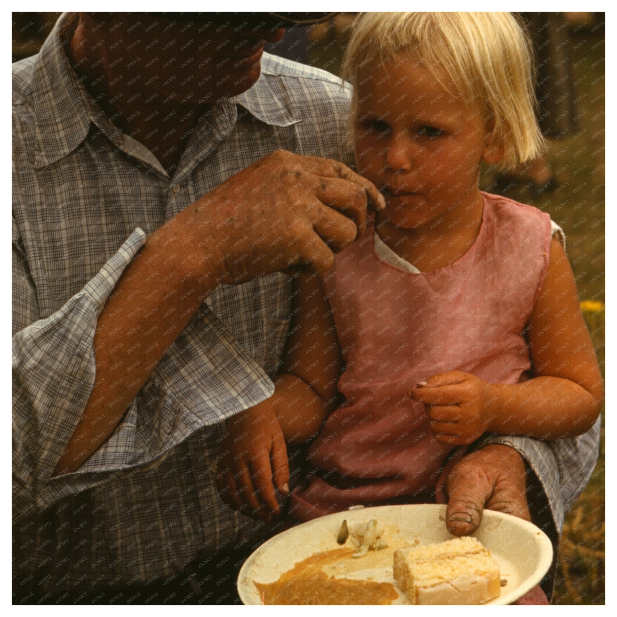 Homesteader Feeds Daughter at Pie Town Fair 1940 - Available at KNOWOL