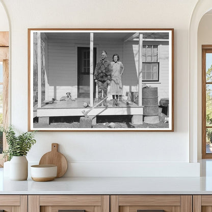 Husband and wife on porch in Chicot Farms Arkansas 1939 - Available at KNOWOL