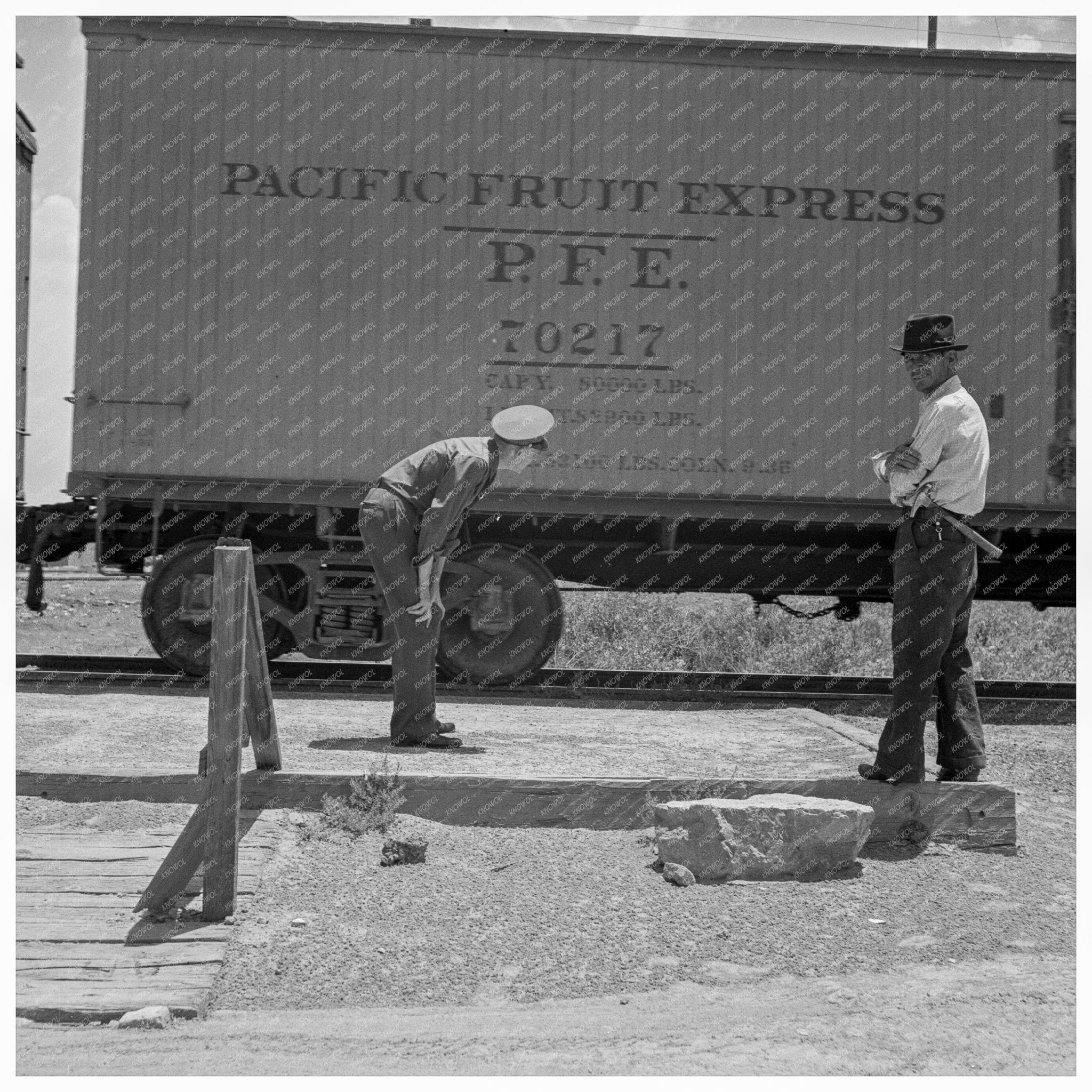 Inspecting Freight Train for Smuggled Immigrants June 1938 - Available at KNOWOL