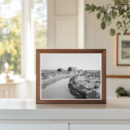 Irrigation Canal and Haystacks in Oregon 1939 - Available at KNOWOL