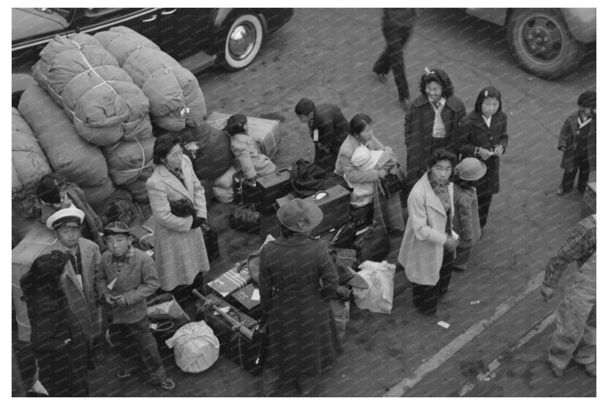 Japanese - Americans Await Transport at LA Train Station 1942 - Available at KNOWOL