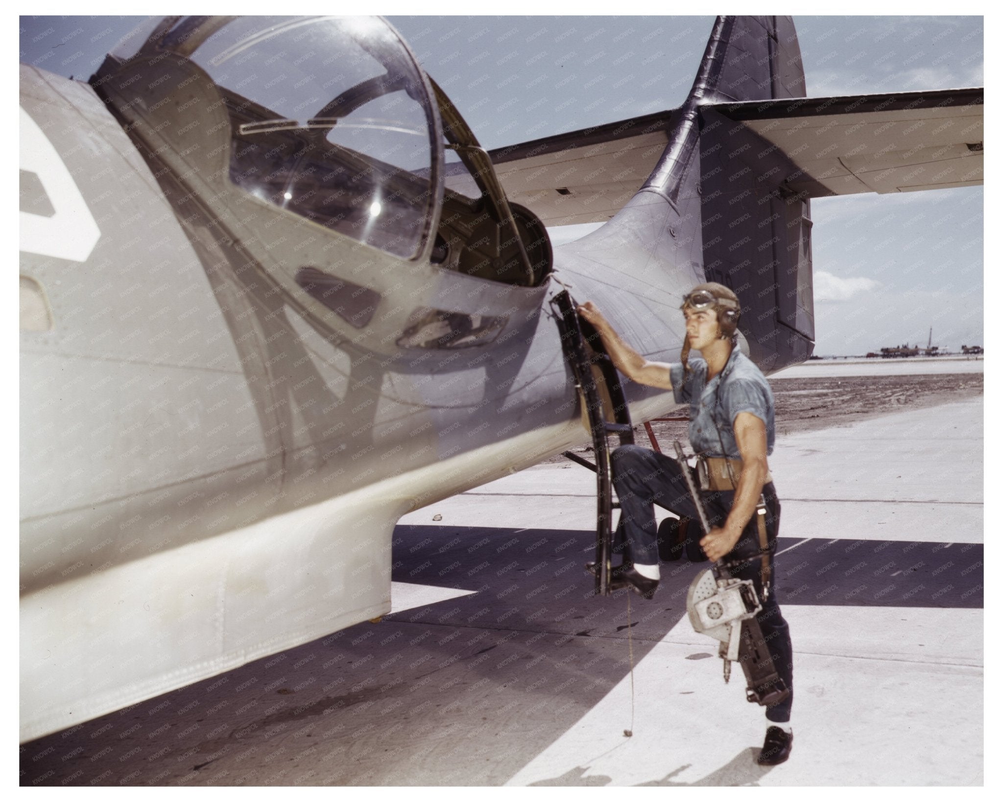 Jesse Rhodes Waller Installing Machine Gun in Navy PBY 1942 - Available at KNOWOL