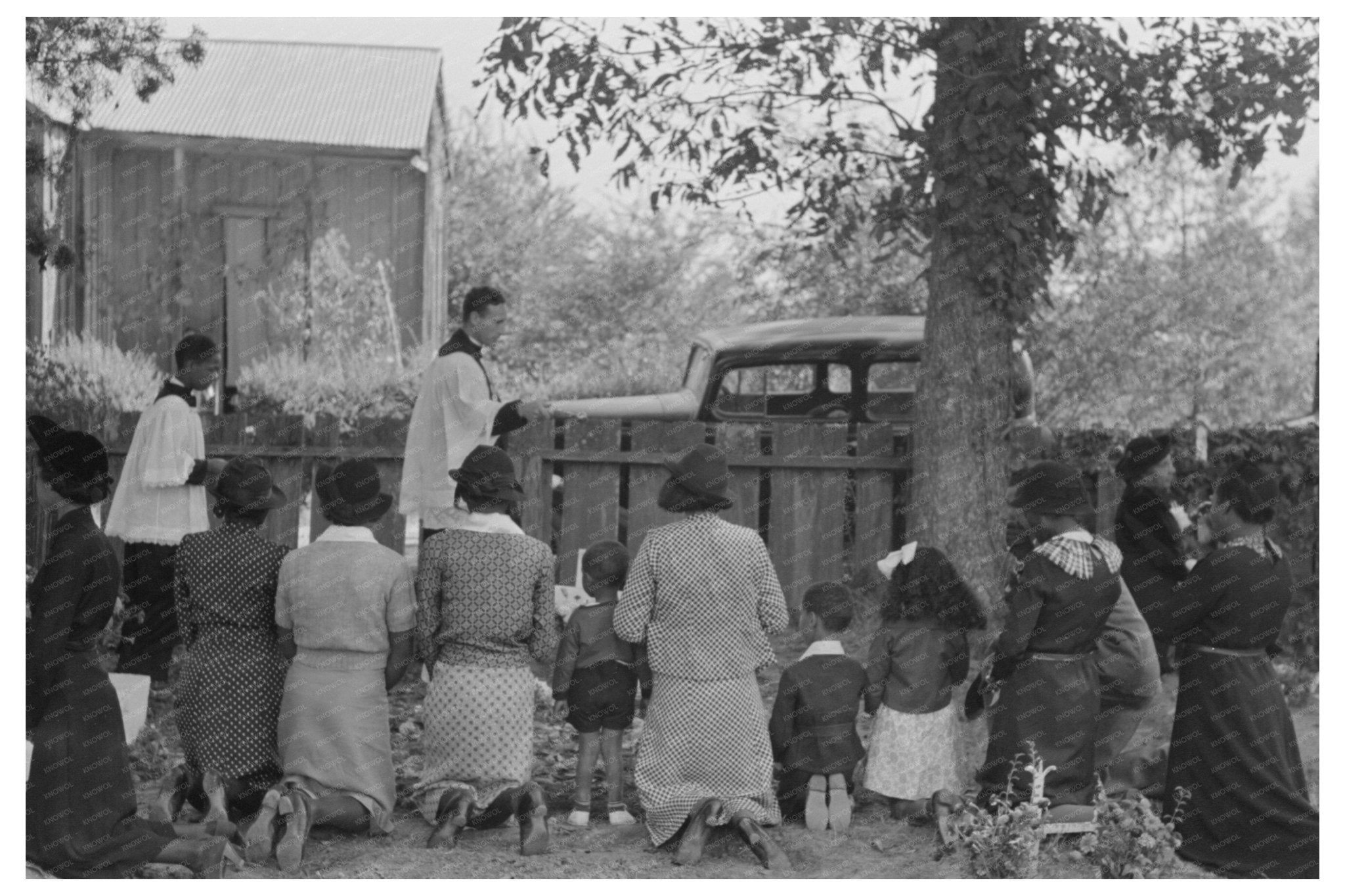 Kneeling at Gravesites in New Roads Louisiana 1938 - Available at KNOWOL