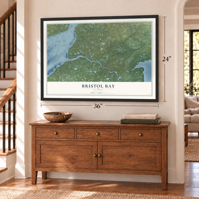 Bristol Bay, Alaska map, 24 x 36 inch print in a black frame above a dresser by a staircase