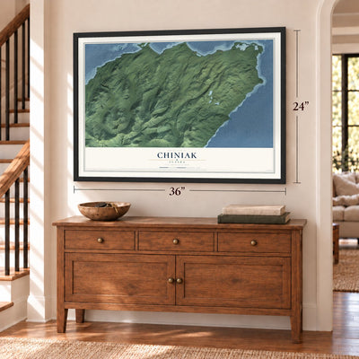 Chiniak, Alaska map, 24 x 36 inch print in a black frame above a dresser by a staircase