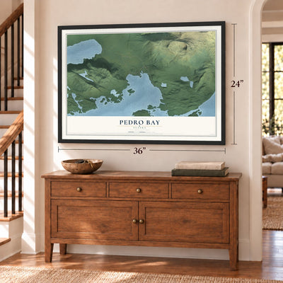 Pedro Bay, Alaska map, 24 x 36 inch print in a black frame above a dresser by a staircase