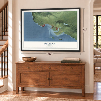 Pelican, Alaska map, 24 x 36 inch print in a black frame above a dresser by a staircase