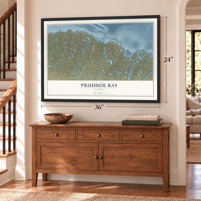 Prudhoe Bay, Alaska map, 24 x 36 inch print in a black frame above a dresser by a staircase