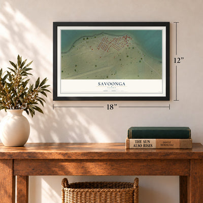 Savoonga, Alaska map, 12 x 18 inch print in a black frame in an entryway