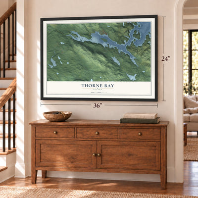 Thorne Bay, Alaska map, 24 x 36 inch print in a black frame above a dresser by a staircase