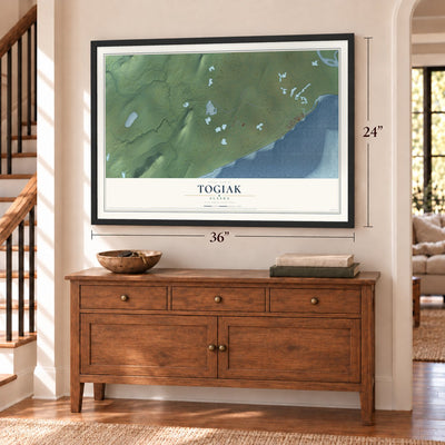Togiak, Alaska map, 24 x 36 inch print in a black frame above a dresser by a staircase