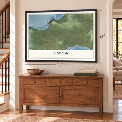 Tununak, Alaska map, 24 x 36 inch print in a black frame above a dresser by a staircase