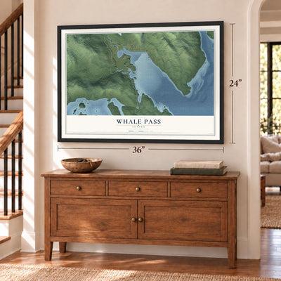 Whale Pass, Alaska map, 24 x 36 inch print in a black frame above a dresser by a staircase