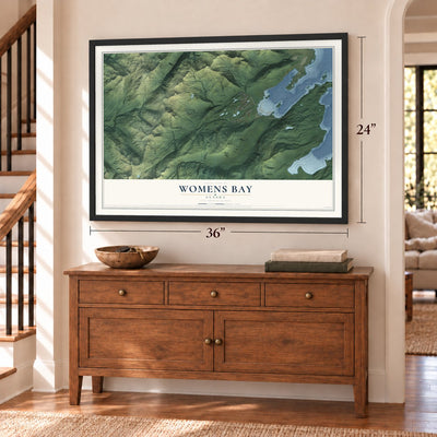 Womens Bay, Alaska map, 24 x 36 inch print in a black frame above a dresser by a staircase