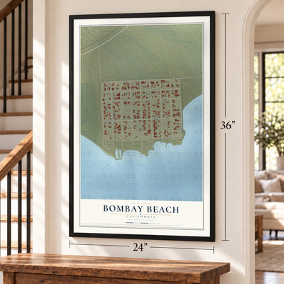 Bombay Beach, California map, 24 x 36 inch print in a black frame by a staircase