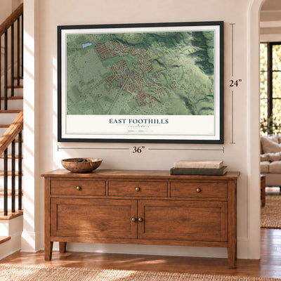 East Foothills, California map, 24 x 36 inch print in a black frame above a dresser by a staircase