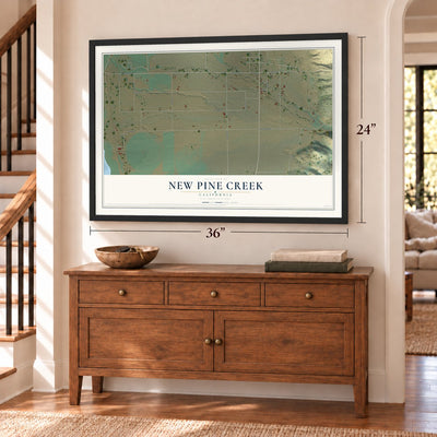 New Pine Creek, California map, 24 x 36 inch print in a black frame above a dresser by a staircase