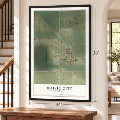 Raisin City, California map, 24 x 36 inch print in a black frame by a staircase