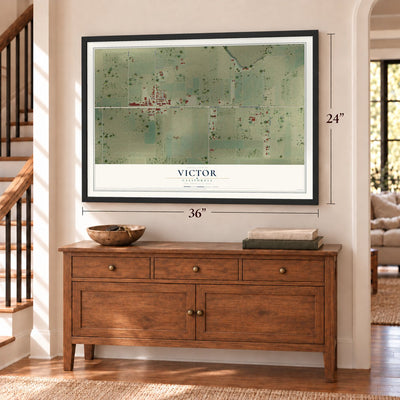 Victor, California map, 24 x 36 inch print in a black frame above a dresser by a staircase
