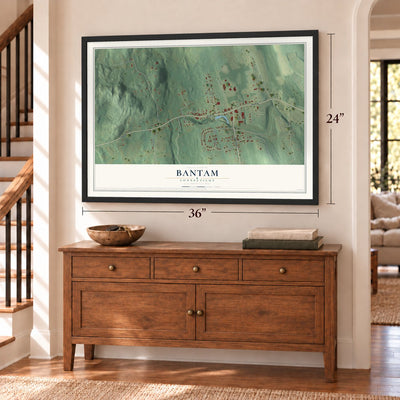 Bantam, Connecticut map, 24 x 36 inch print in a black frame above a dresser by a staircase