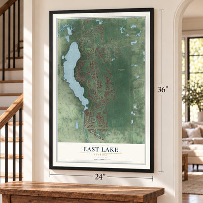 East Lake, Florida map, 24 x 36 inch print in a black frame by a staircase