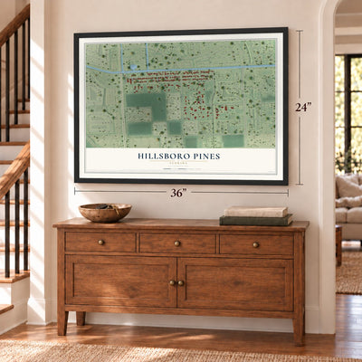 Hillsboro Pines, Florida map, 24 x 36 inch print in a black frame above a dresser by a staircase