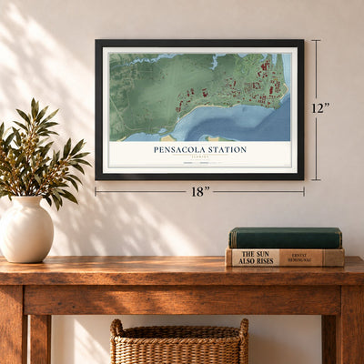 Pensacola Station, Florida map, 12 x 18 inch print in a black frame in an entryway